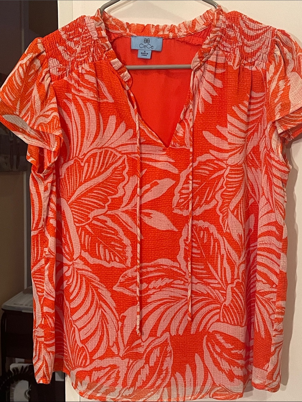CeCe Orange and white tropical leaf pattern short-sleeve blouse